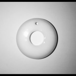 White doughnut-shaped pendant